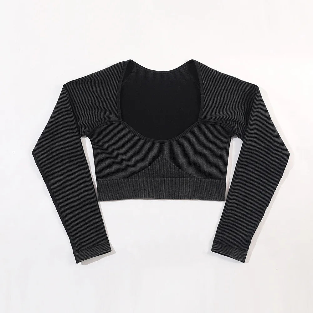 Black long-sleeve crop top on a white background