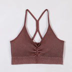 Brown ribbed crop top with criss-cross straps on a white background