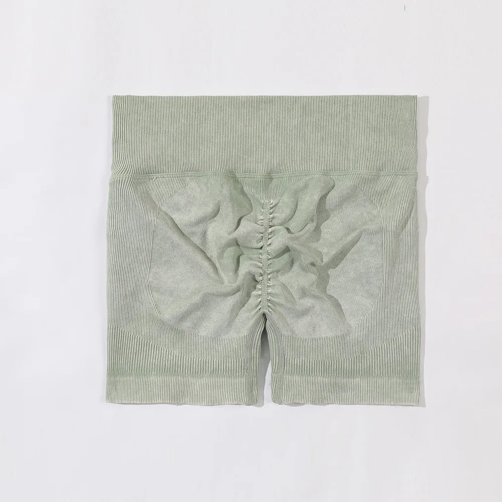 Green ribbed knit fabric on a white background