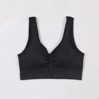 Black ribbed tank top on a light gray background