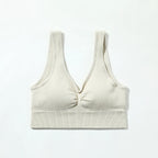 Beige ribbed tank top on a white background