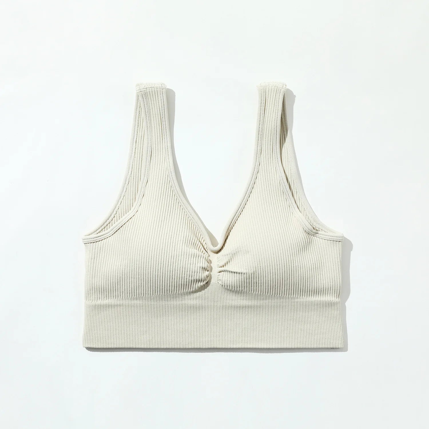 Beige ribbed tank top on a white background