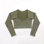 Green long-sleeve crop top on a white background