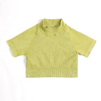Yellow ribbed turtleneck sweater on a white background