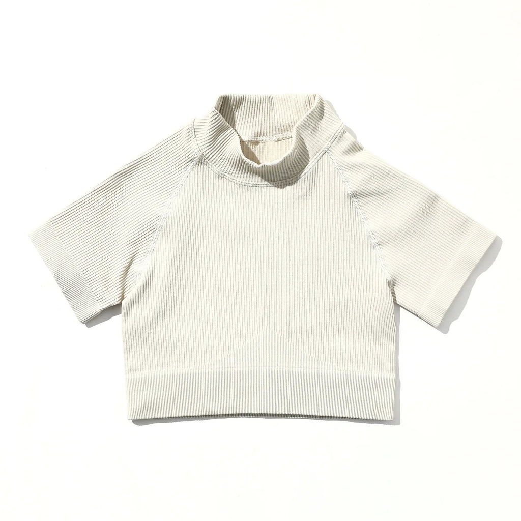 White ribbed knit crop top on a white background
