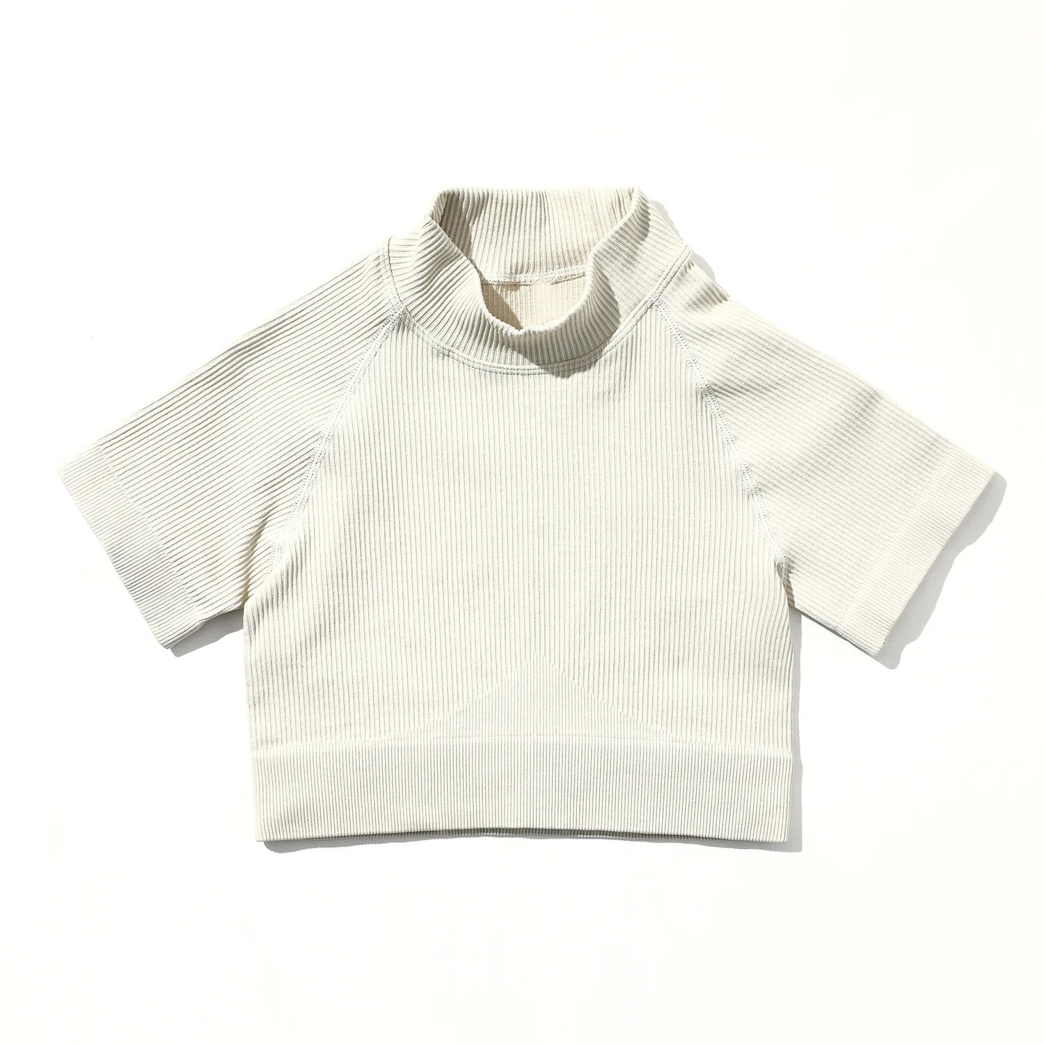 White ribbed knit crop top on a white background