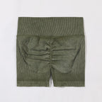 Green ribbed knit shorts on a white background