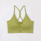 Green ribbed crop top with thin straps on a white background