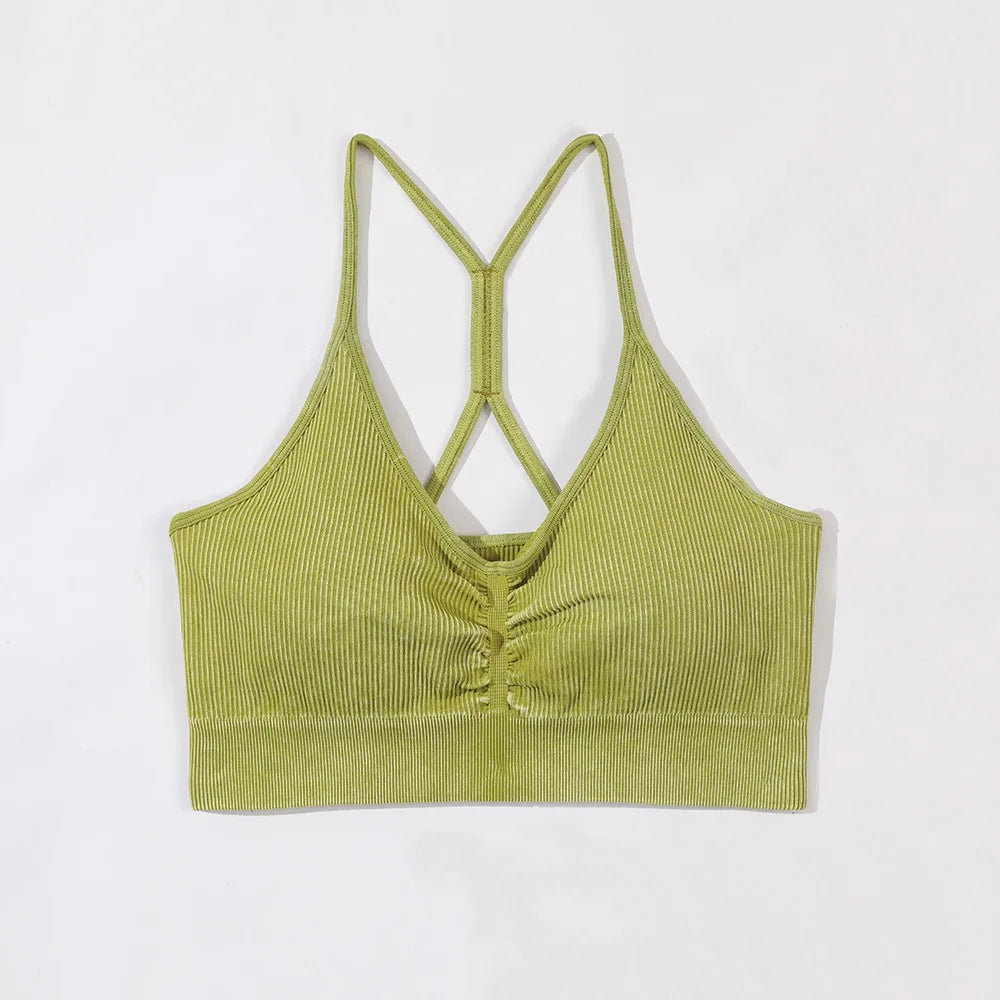 Green ribbed crop top with thin straps on a white background