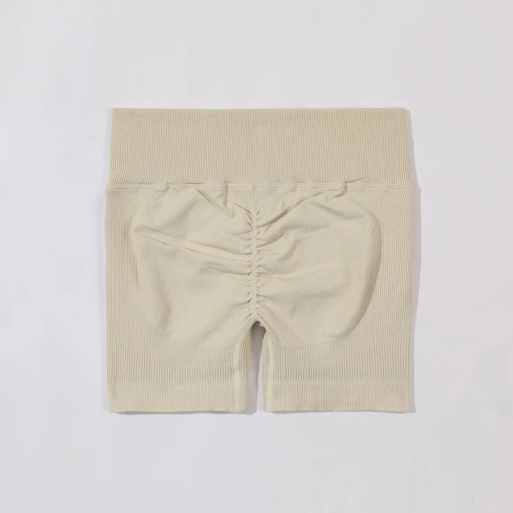 Beige ribbed shorts on a light gray background