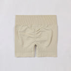 Beige ribbed shorts on a light gray background