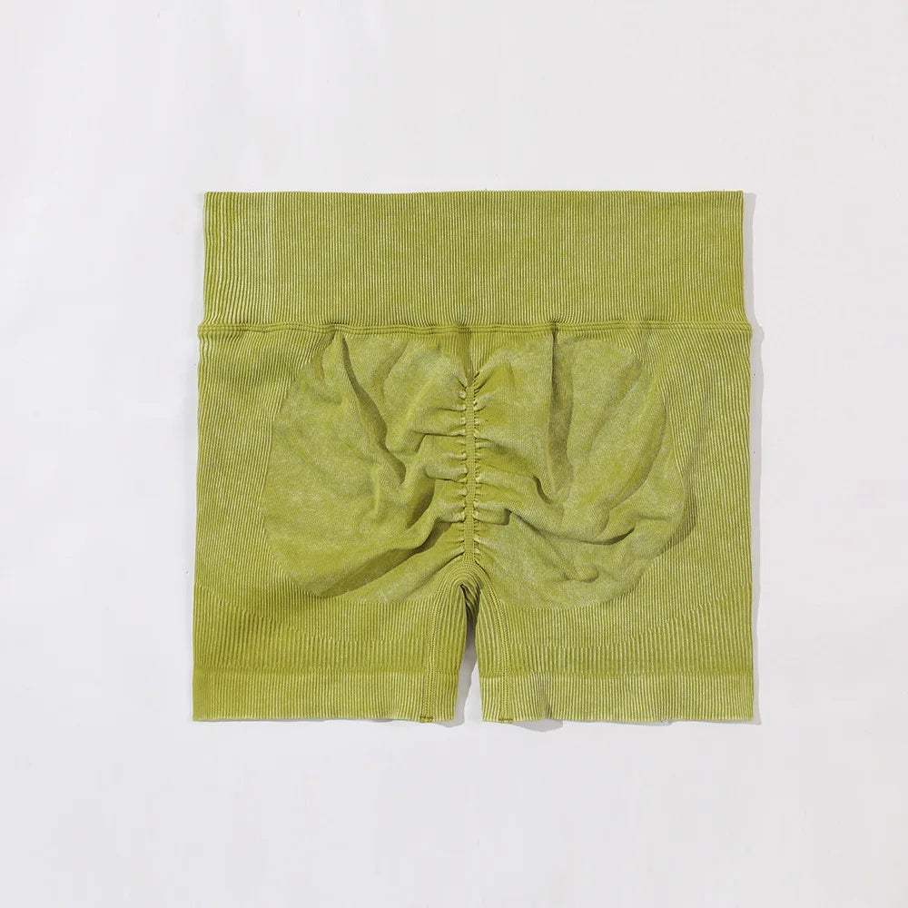 Green ribbed shorts on a white background