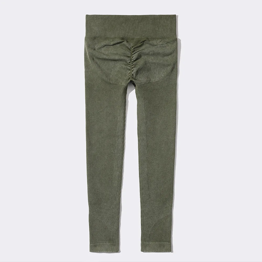 Green leggings on a light gray background